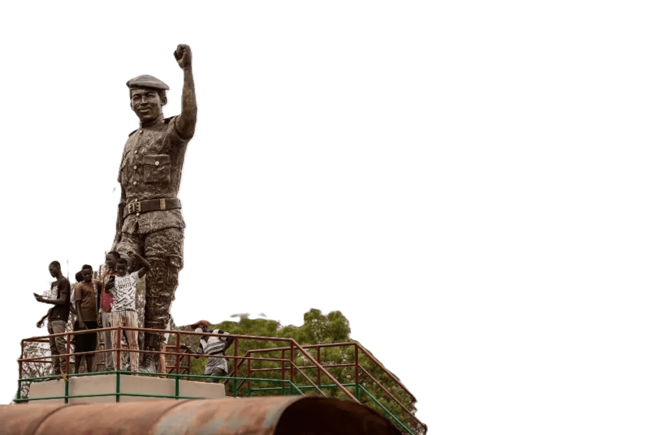 Young Burkinabè citizens visiting a statue of revolutionary leader Thomas Sankara